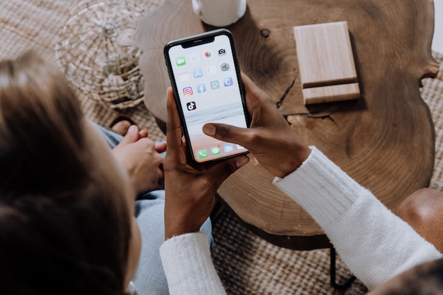 person showing someone else their smartphone